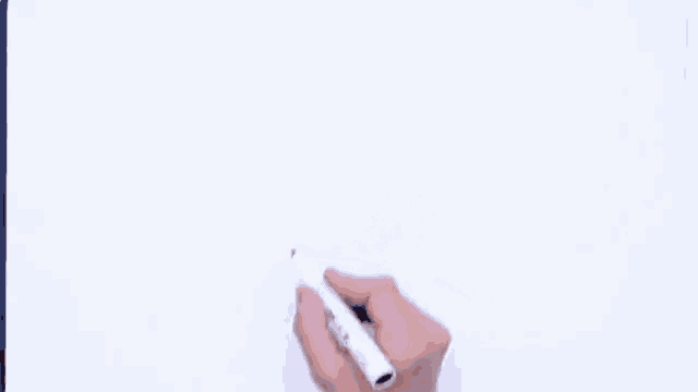 a person drawing a cake with a bow on top