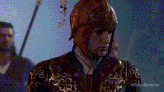a man wearing a helmet and a red and gold outfit with nemo-beatrice written on the bottom