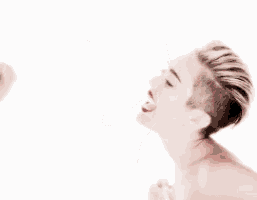 a naked woman is raising her arms in the air .