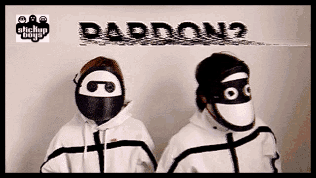 two people wearing masks in front of a sign that says baddon2
