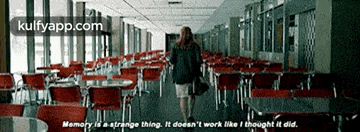a woman is walking down a hallway with tables and chairs and a quote about memory