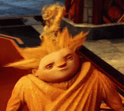 a close up of a cartoon character with yellow hair and a yellow shirt
