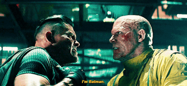 two men standing next to each other and one of them says i 'm batman