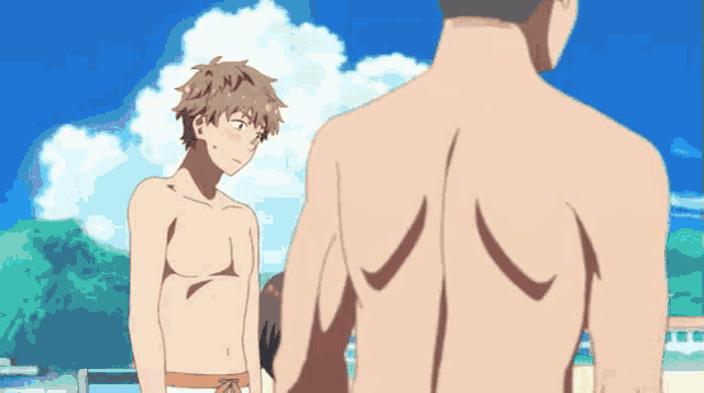 a shirtless man with a beard looks at the camera