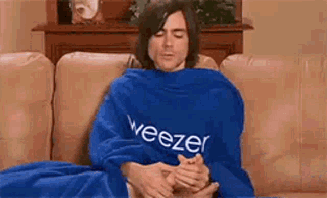 Weezer Snuggie GIF - Weezer Snuggie Foot Massage GIFs