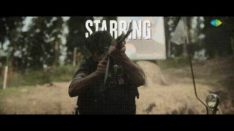 a man holding a gun with the word starring behind him