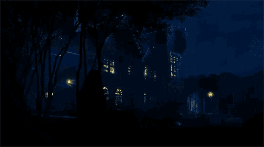 a dark night scene of a house with lights on