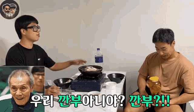 a man sitting at a table with a bottle of water and a jar of honey
