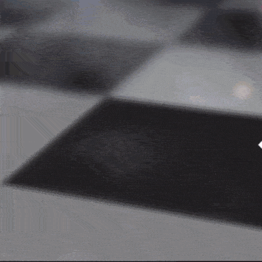 a black and white checkered floor with a arrow pointing to the right