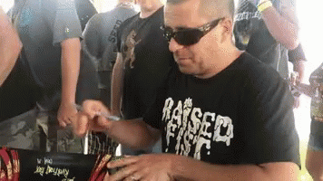 Slightly Stoopid Autograph Signing GIF - Slightly Stoopid Autograph Signing Raised Fist Propaganda GIFs