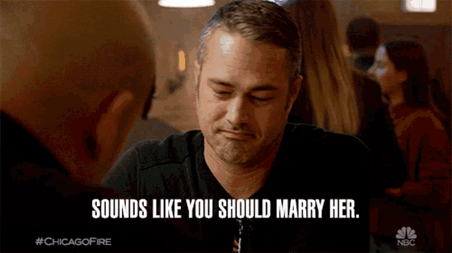 a man sitting at a table with the words " sounds like you should marry her "