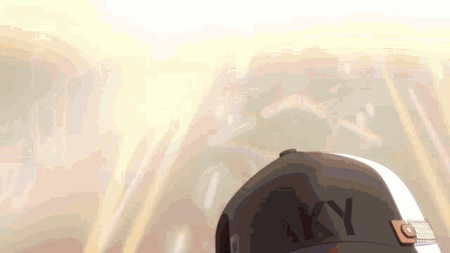 a close up of a hat with the word aky on it