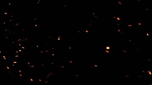 a circle of fire is surrounded by a dark background
