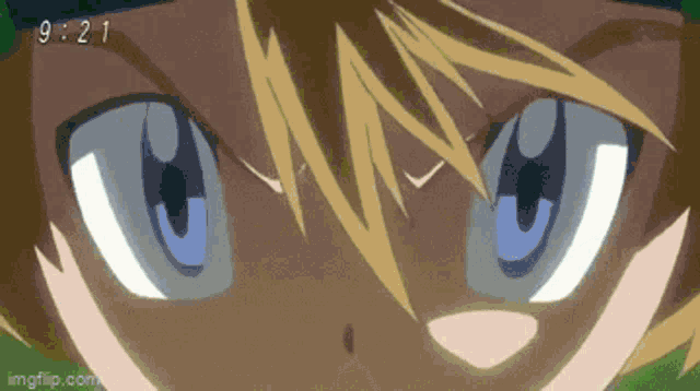 a close up of a person 's eyes with the time 9.21 on the bottom right