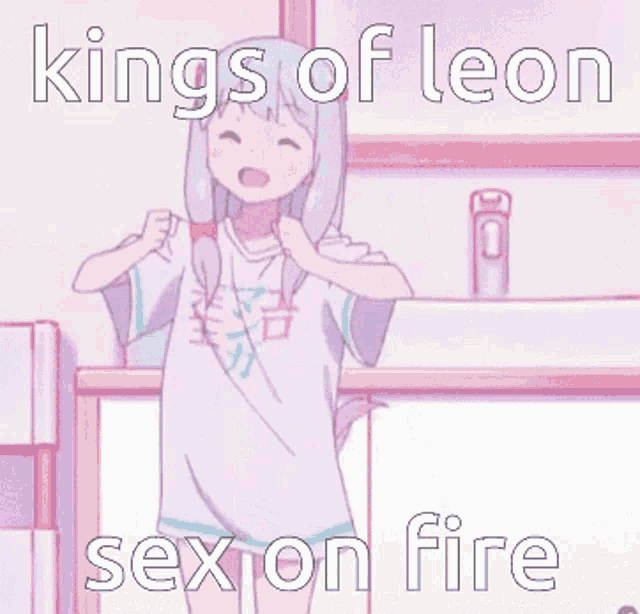 a girl is standing in front of a sink wearing a shirt that says kings of leon sex on fire .
