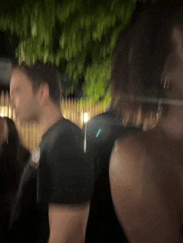 a blurry photo of a man and a woman
