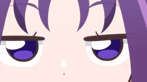 a close up of a cartoon character 's eyes with purple hair