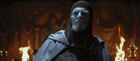 a man in a knight 's armor stands in front of a fire with the words " you have " written below him