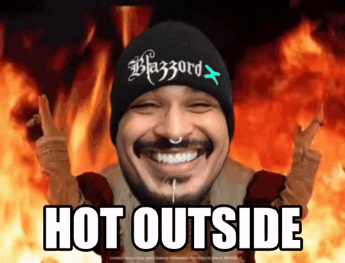 a man wearing a beanie that says blazzard on it is smiling