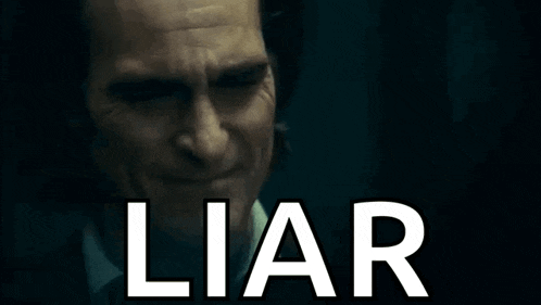 a close up of a man 's face with the word liar written on it .