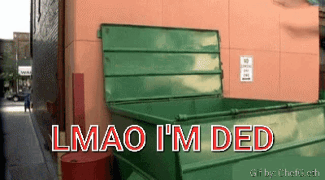 a green dumpster with the words " lmao i 'm ded " written on it