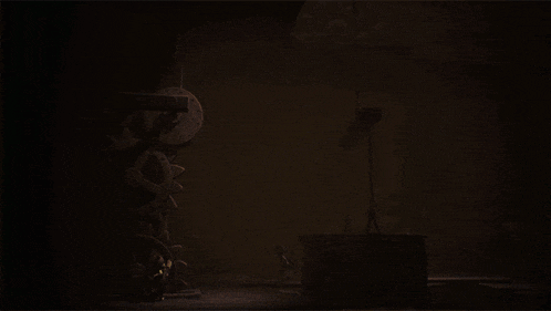 a dark room with a clock on the wall and a person standing in the dark