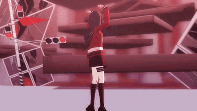 a girl in a red dress is dancing in front of a traffic light