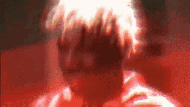 a close up of a person 's face with flames coming out of it