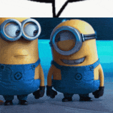 two minions standing next to each other wearing blue overalls and goggles