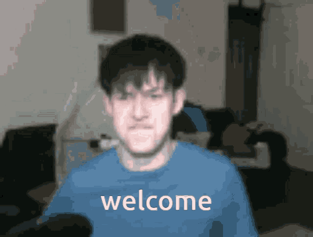 a blurry picture of a man with the words welcome written on the bottom