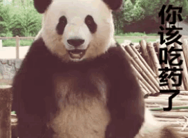a panda bear is standing in front of a pile of logs with chinese writing on it