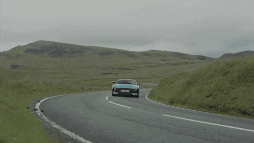 a blue sports car with a license plate that says ytz ak