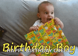 a baby holding a birthday present with the words happy birthday gregg