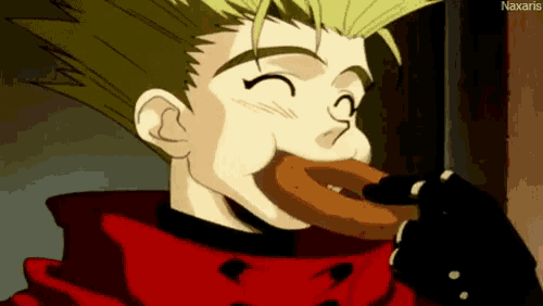 a man in a red jacket is eating a donut with his mouth open .