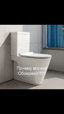 a white toilet is sitting on a tiled floor in a bathroom next to a window .