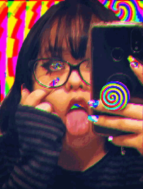 a girl with glasses is taking a selfie with a colorful background