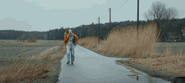 a person walking down a road with a backpack on