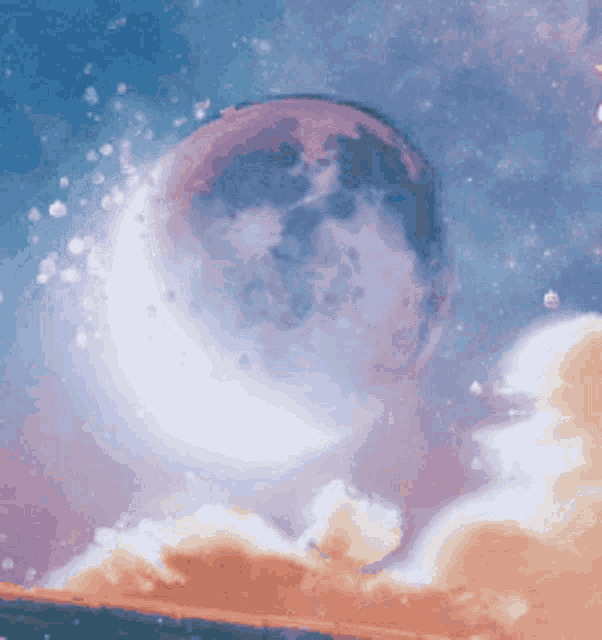 a full moon is visible in the night sky above clouds