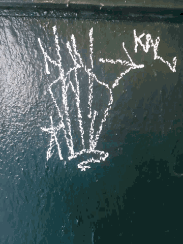 a drawing of a witch is written on the water