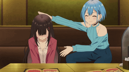 a girl with blue hair is putting her hand on another girl 's forehead