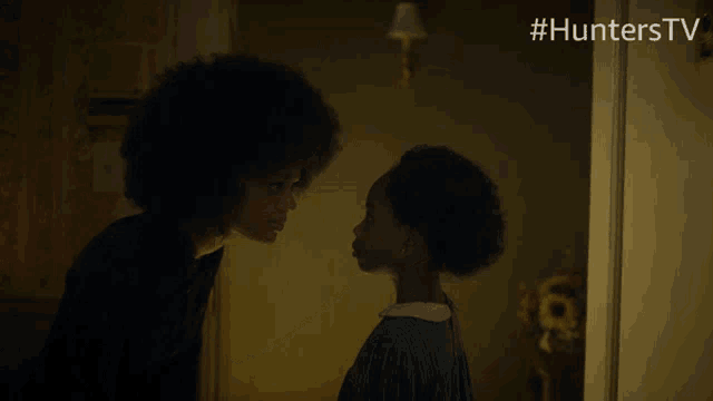 a woman and a child are looking at each other with #hunterstv in the corner