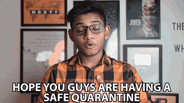 a man wearing glasses and a plaid shirt says " hope you guys are having a safe quarantine "