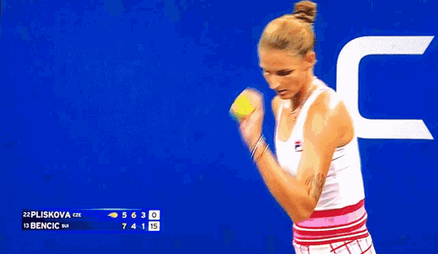 a woman is holding a tennis racquet in front of a scoreboard that says pluskova cze