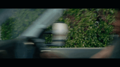 a blurred image of a car driving down the road