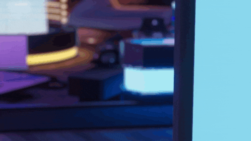 a blurred image of a computer monitor with a blue light behind it