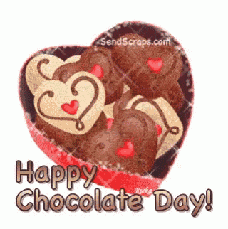 a heart shaped box of chocolates with the words happy chocolate day written on it