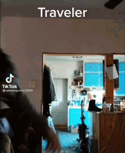 a person is standing in a room with the word traveler on the bottom