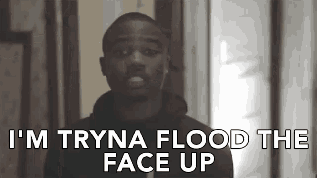 a man is standing in front of a door and saying i 'm tryna flood the face up