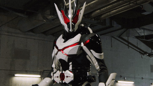 a man in a black and white costume with a red stripe on his chest