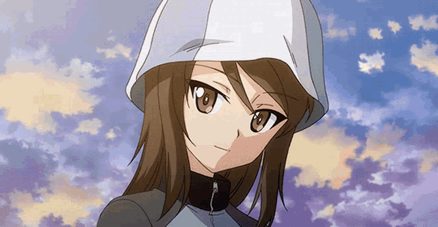 a girl wearing a hooded jacket looks at the camera